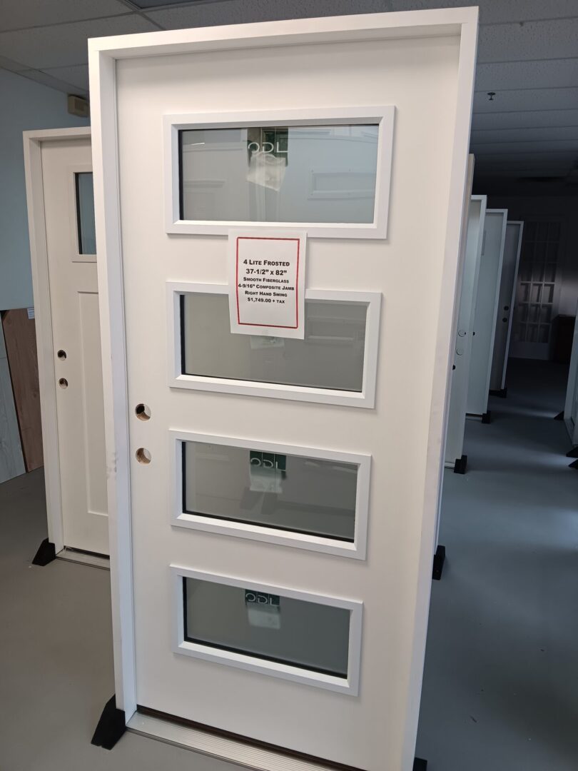 exterior door with four glass inserts displayed inside warehouse