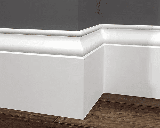 white baseboard corner with wooden floor