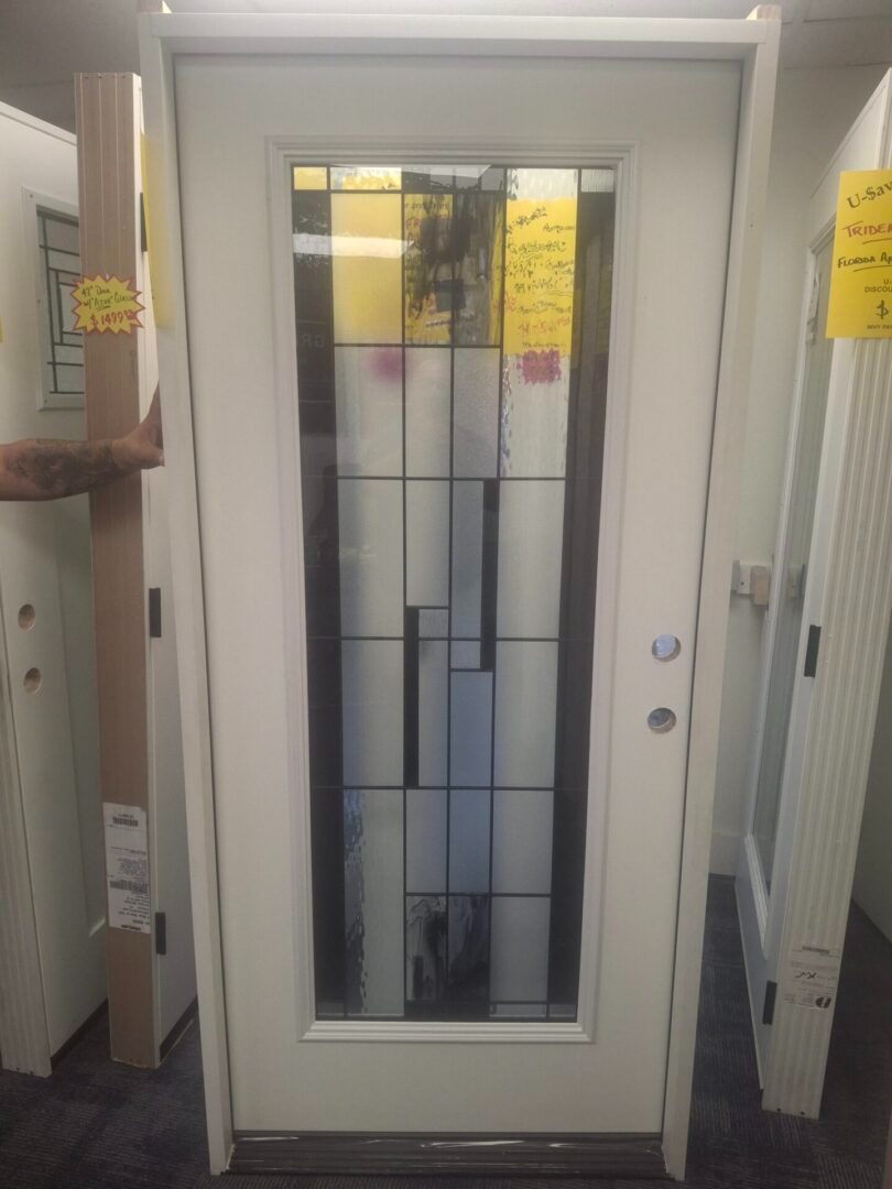 exterior door with glass insert displayed in warehouse