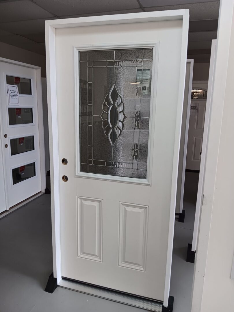 exterior door with glass insert displayed inside warehouse